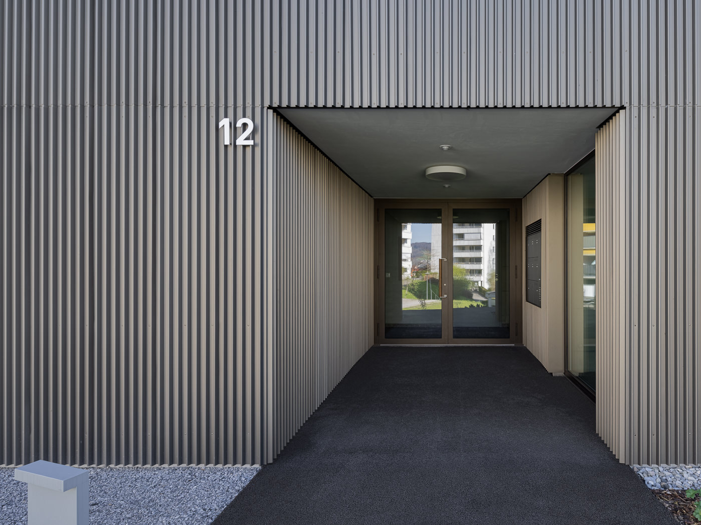 buan architekten – Neubau Wohnhaus Waldweg Luzern – Hauseingang